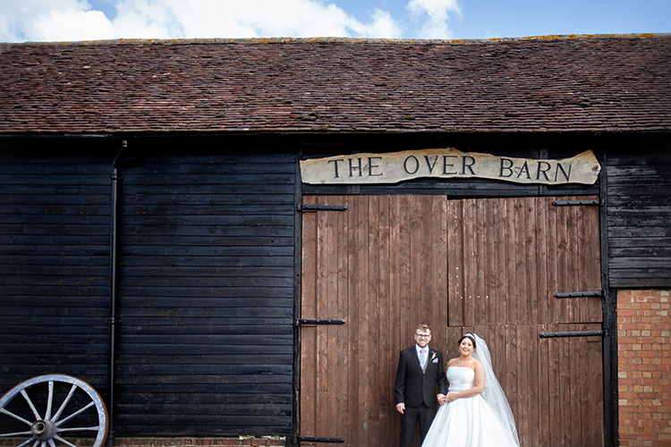 bride and groom at over barn