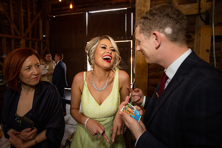 Wedding guest laughing at Magician.
