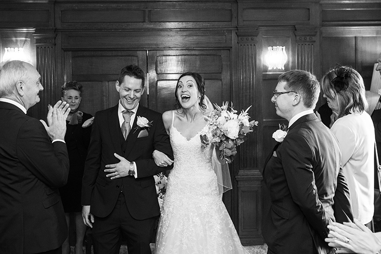 Bride and Groom laughing.