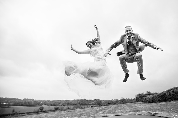 Bride and groom on trampoline