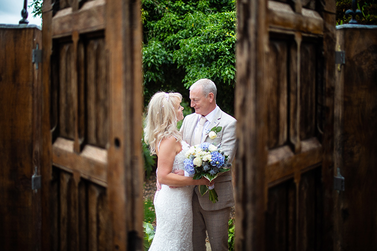 Bride and Groom through door