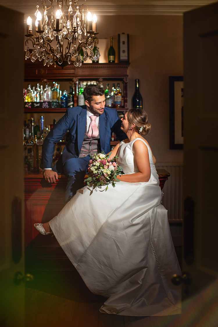 Bride and Groom at bar.