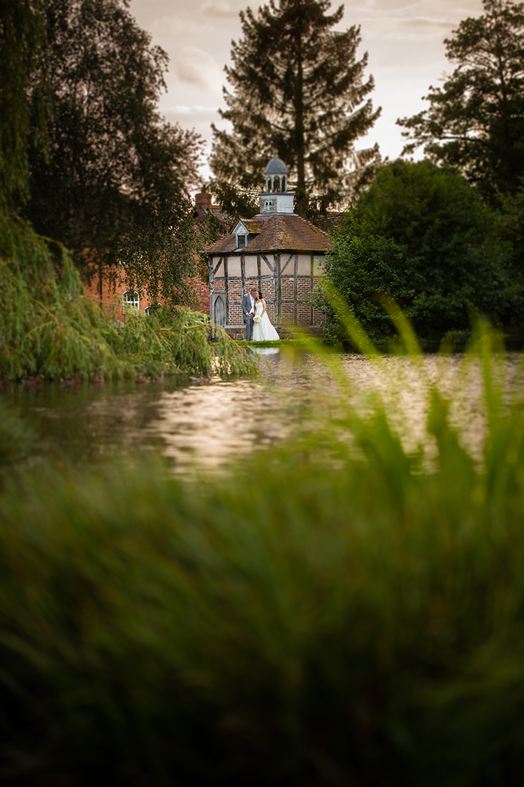 Bride and Groom across the lake.