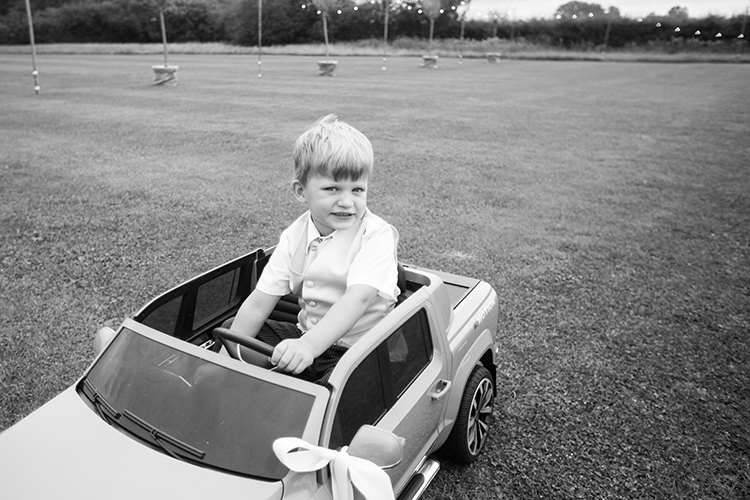 The paige boy in his toy car