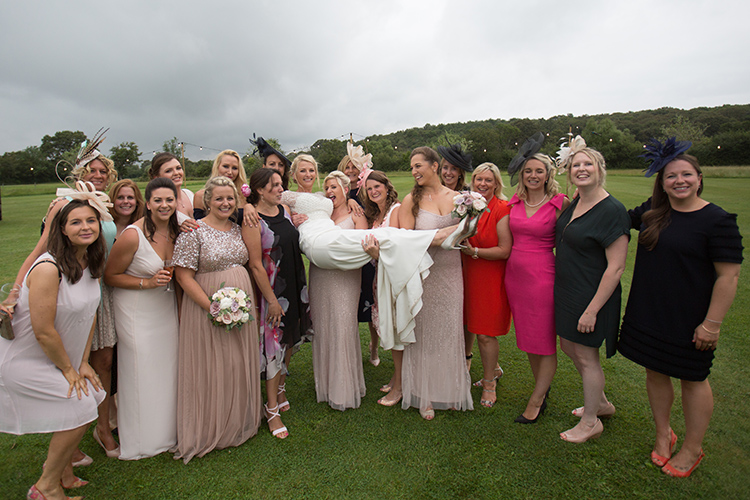 The girls holding the Bride.